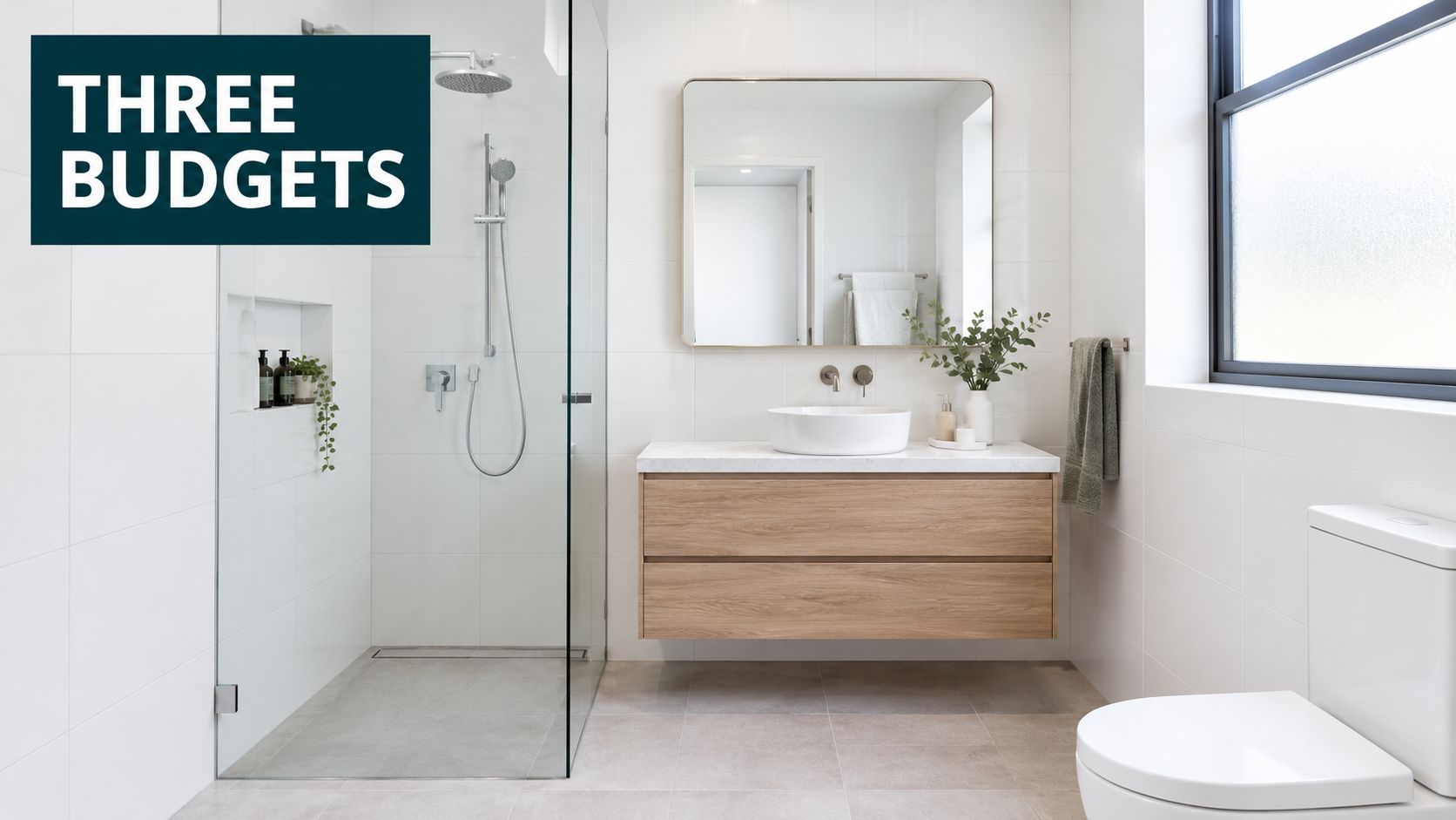 A bright, modern bathroom featuring a floating wooden vanity, walk-in glass shower, and white tiled walls.